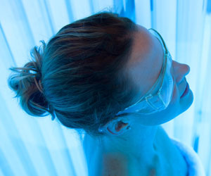 woman in UV light box